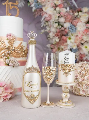 Gold quinceanera package of bottle, glass and candle